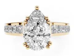 Pear Cut Diamond Channel Set Solitaire Engagement Ring Set in Yellow gold with Prong Setting