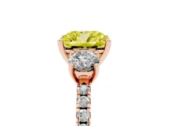 Fancy Yellow Cushion Cut Diamond Three-Stone Ring Set in Rose gold with Pavé Band and Graduated Sides