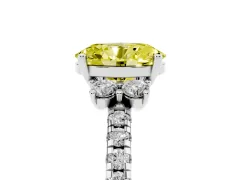 Fancy Yellow Oval Cut Diamond Three-Stone Pavé Ring Set in White gold with Prong Setting