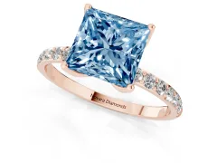 Fancy Blue Princess Cut Diamond Solitaire Engagement Ring Set in Rose gold with Round Pavé Band and Prong Setting
