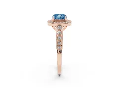 Fancy Blue Cushion Cut Diamond Milgrain Halo Solitaire Ring Set in Rose gold with Bezel Set Side Stones and Pavé Band