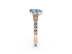 Fancy Blue Pear Cut Diamond Three-Stone Ring Set in Rose gold with Round Side Stones and Delicate Pavé Band