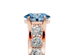 Fancy Blue Oval Cut Diamond Pavé Engagement Ring Set in Rose gold with Prong Setting