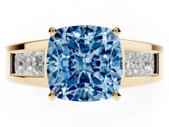 Fancy Blue Cushion Cut Diamond Solitaire Ring Set in Yellow gold with Channel-Set Accent Stones and Prong Setting