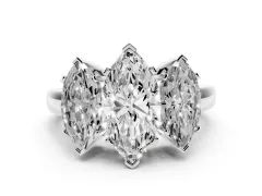 Marquise Cut Diamond Three-Stone Ring Set in White gold with Channel-Set Band and Prong Settings