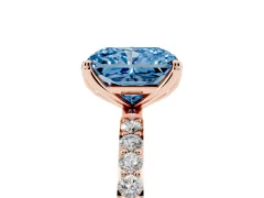 Fancy Blue Radiant Cut Diamond Solitaire Engagement Ring Set in Rose gold with Round Pavé Band and Prong Setting