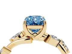 Fancy Blue Radiant Cut Diamond Solitaire Ring Set in Yellow gold with Twisted Marquise Accent Band