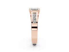 Emerald Cut Diamond Solitaire Ring Set in Rose gold with Channel-Set Accent Stones and Prong Setting