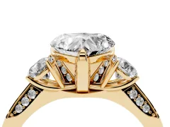 Heart Cut Diamond Three-Stone Ring Set in Yellow gold with Pavé Band and Smaller Side Stones