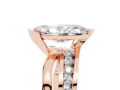 Marquise Cut Diamond Solitaire Ring Set in Rose gold with Channel Set Split Shank and Tension Prongs