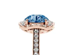 Fancy Blue Round Cut Diamond Halo Ring Set in Rose gold with Pavé-Lined Shoulders and Prong Setting