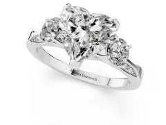 Heart Cut Diamond Three-Stone Ring Set in White gold with Pavé Band and Smaller Side Stones