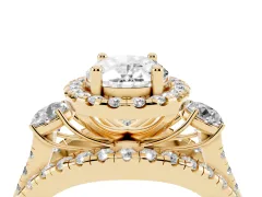 Oval Cut Diamond Halo Split Shank Ring Set in Yellow gold with Round Accent Stones and Prong Setting