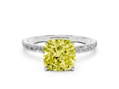 Fancy Yellow Cushion Cut Diamond Solitaire Engagement Ring Set in White gold with Round Pavé Band and Prong Setting