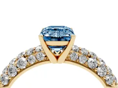 Fancy Blue Emerald Cut Diamond Pavé Band Solitaire Ring Set in Yellow gold with Close-Set Accent Stones and Prong Setting