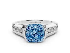 Fancy Blue Cushion Cut Diamond Bezel-Set Solitaire Ring Set in White gold with Channel-Set Band