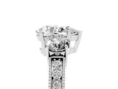 Pear Cut Diamond Three-Stone Ring Set in White gold with Round Side Stones and Pavé Band