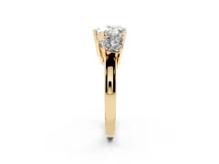 Heart Cut Diamond Three-Stone Ring Set in Yellow gold with Channel-Set Band and Prong Settings