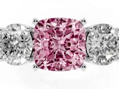 Fancy Pink Cushion Cut Diamond Three-Stone Ring Set in Platinum with Round Side Stones and Classic Band