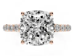 Cushion Cut Diamond Solitaire Engagement Ring Set in Rose gold with Round Pavé Band and Prong Setting
