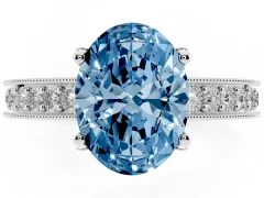 Fancy Blue Oval Cut Diamond Solitaire Ring Set in Platinum with Milgrain-Edged Pavé Band and Prong Setting