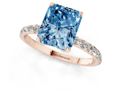 Fancy Blue Radiant Cut Diamond Solitaire Engagement Ring Set in Rose gold with Round Pavé Band and Prong Setting