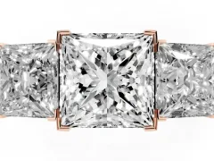 Princess Cut Diamond Three-Stone Ring Set in Rose gold with Channel-Set Band and Prong Settings