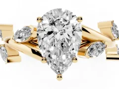 Pear Cut Diamond Solitaire Ring Set in Yellow gold with Twisted Marquise Accent Band