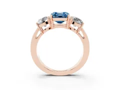 Fancy Blue Asscher Cut Diamond Three-Stone Ring Set in Rose gold with Round Side Stones and Classic Band