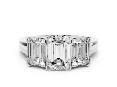 Emerald Cut Diamond Three-Stone Ring Set in Platinum with Channel-Set Band and Prong Settings