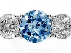 Fancy Blue Round Cut Diamond Three-Stone Ring Set in Platinum with Prong Setting and Plain Band