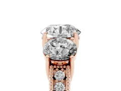 Round Cut Diamond Three-Stone Engagement Ring Set in Rose gold with Milgrain Pavé Band