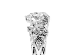 Heart Cut Diamond Three-Stone Ring Set in White gold with Braided Band