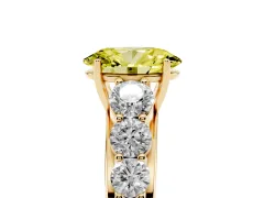 Fancy Yellow Oval Cut Diamond Solitaire Ring Set in Yellow gold with Pavé-Set Band and Prong Setting