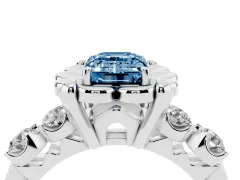 Fancy Blue Emerald Cut Diamond Floral Halo Ring Set in White gold with Shared Prong Band