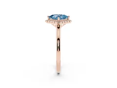 Fancy Blue Princess Cut Diamond Halo Engagement Ring Set in Rose gold with Pavé Band and Rising Shoulders