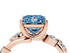 Fancy Blue Princess Cut Diamond Solitaire Ring Set in Rose gold with Twisted Marquise Accent Band