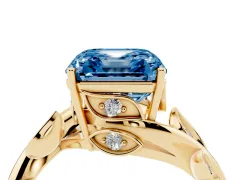 Fancy Blue Asscher Cut Diamond Solitaire Twist Engagement Ring Set in Yellow gold with Pavé Leaf Accents