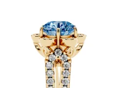 Fancy Blue Round Cut Diamond Floral Halo Split Shank Engagement Ring Set in Yellow gold with Pavé Shank