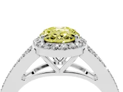 Fancy Yellow Oval Cut Diamond Halo Split Shank Pavé Ring Set in White gold with Prong Setting