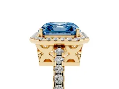 Fancy Blue Asscher Cut Diamond Halo Ring Set in Yellow gold with Pavé Shoulders and Halo-Framed Center