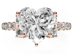 Heart Cut Diamond Three-Stone Pavé Ring Set in Rose gold with Prong Setting