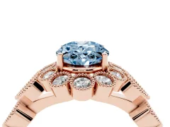 Fancy Blue Oval Cut Diamond Solitaire Ring Set in Rose gold with Milgrain Pavé Heart Band