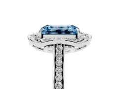 Fancy Blue Emerald Cut Diamond Halo Ring Set in Platinum with Pavé-Lined Shoulders and Prong Setting