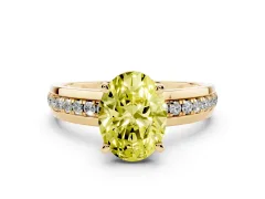 Fancy Yellow Oval Cut Diamond Solitaire Ring Set in Yellow gold with Channel Set Band and Prong Setting