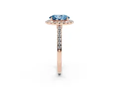Fancy Blue Oval Cut Diamond Halo Pavé Engagement Ring Set in Rose gold with Prong Setting