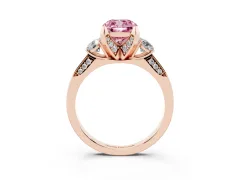 Fancy Pink Cushion Cut Diamond Three-Stone Ring Set in Rose gold with Pavé Band and Smaller Side Stones