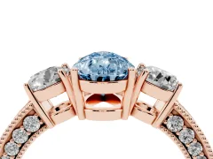 Fancy Blue Pear Cut Diamond Three-Stone Ring Set in Rose gold with Round Side Stones and Pavé Band