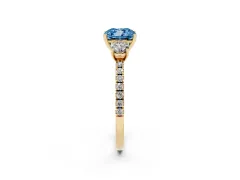 Fancy Blue Cushion Cut Diamond Three-Stone Ring Set in Yellow gold with Pavé Band and Graduated Sides