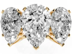 Pear Cut Diamond Three-Stone Ring Set in Yellow gold with Channel-Set Band and Prong Settings